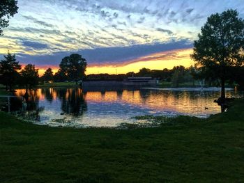 Scenic view of lake at sunset