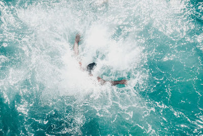 High angle view of man surfing in water