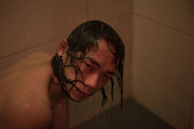 Portrait of young woman in bathroom