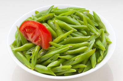 Close-up of green chili peppers in bowl