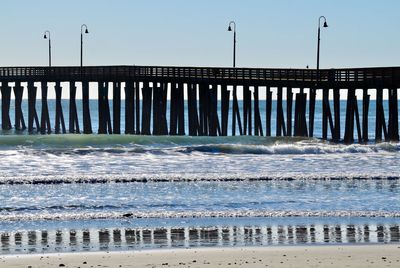 Scenic view of pier over sea against sky