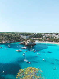 High angle view of bay against clear blue sky