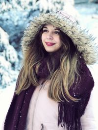Young woman wearing fur coat during winter