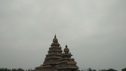 Low angle view of statue against sky