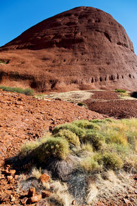 Scenic view of desert land against sky