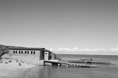 Shipyard on shore against sky