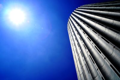 Low angle view of modern building against blue sky