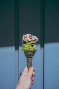 Person holding ice cream cone