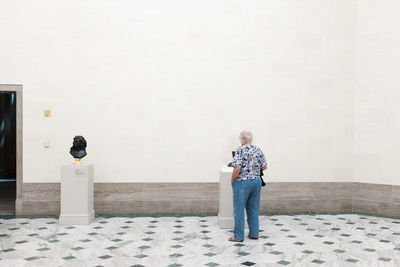 Rear view of woman in art museum