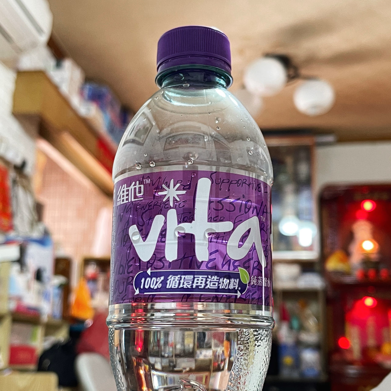 bottle, drink, container, indoors, soft drink, food and drink, focus on foreground, text, refreshment, no people, glass, water, label, close-up, western script