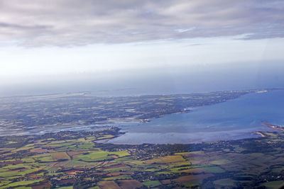 Aerial view of agricultural field against sky