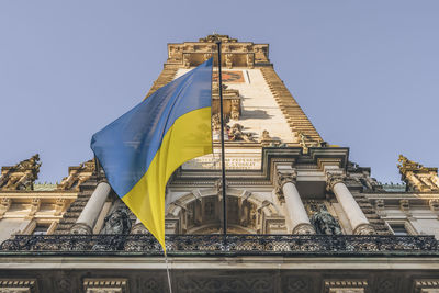 Germany, hamburg, ukrainian flag hanging on hamburg city hall