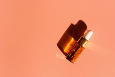 Close-up of electronic cigarette against yellow background