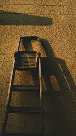 High angle view of ladder on wall