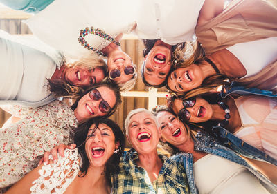 Portrait of smiling women against ceiling