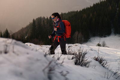 Hiking at sunset in the snow