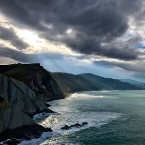 Scenic view of sea against cloudy sky