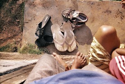 Low section of man sitting outdoors