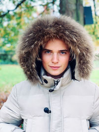 Portrait of young man standing outdoors during winter