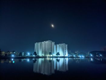 Illuminated buildings in city at night