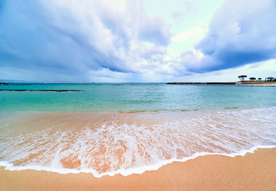 Scenic view of beach against sky