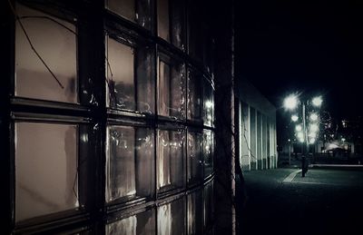 Illuminated lamp in city at night