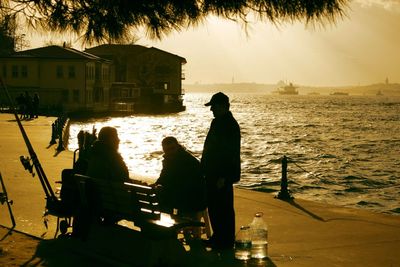 View of two people sitting in water