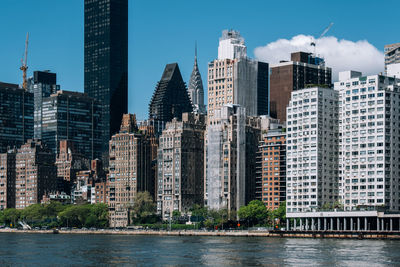 Modern buildings in city against sky