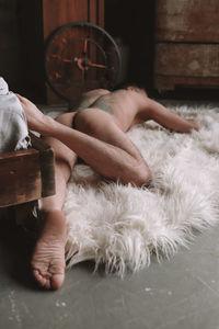 Low section of woman sitting on floor