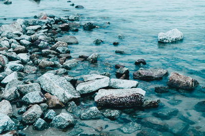 High angle view of rocks in sea