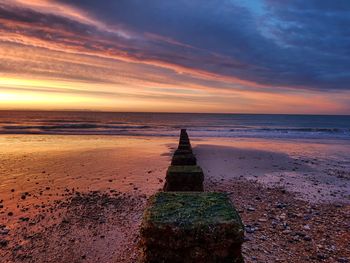 Scenic view of sea against sky at sunset