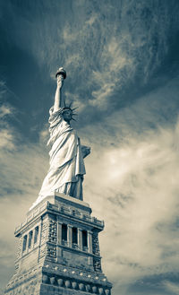 Low angle view of statue against cloudy sky