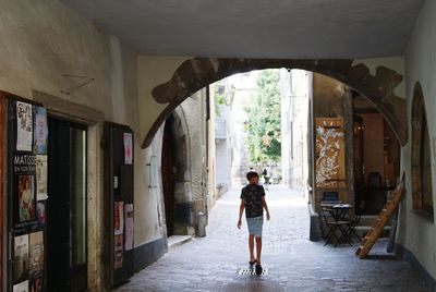 Low angle view of man standing in front of building