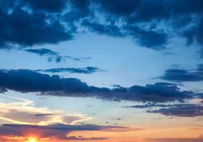 Low angle view of dramatic sky during sunset