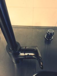 Close-up of faucet in water