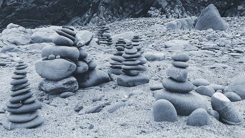 Pebbles on sand at beach during winter