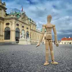 Statue of historic building against cloudy sky