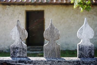 Close-up of wooden fence against house