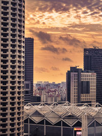 Cityscape against sky during sunset