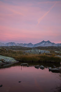 Scenic view of lake against sky during sunset