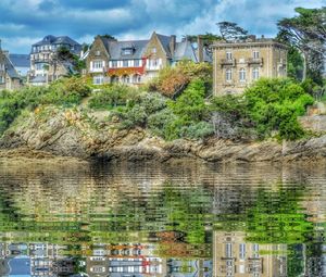 View of buildings against cloudy sky