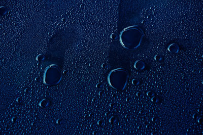 Close-up of water drops on glass