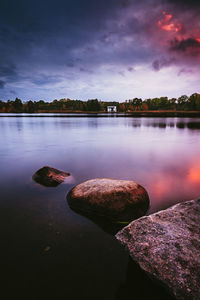 Scenic view of lake against sky during sunset