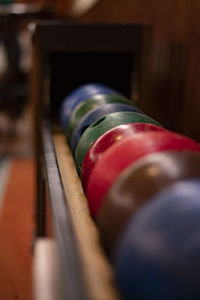 Close-up of multi colored pool balls on table