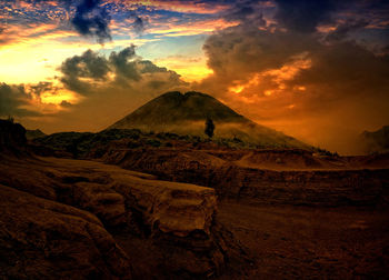 Scenic view of landscape against sky during sunset