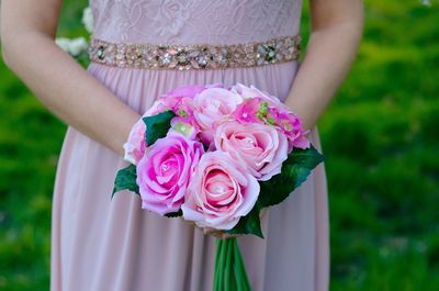 Close-up of woman holding bouquet