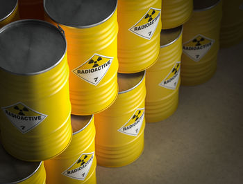 High angle view of yellow radioactive containers
