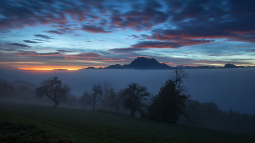 Scenic view of landscape against sky during sunset