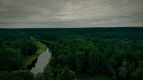 Scenic view of landscape against cloudy sky