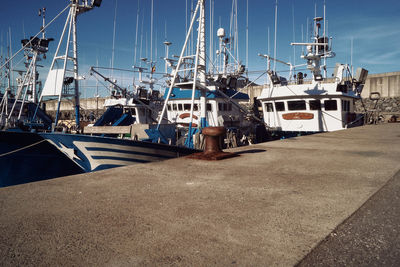 Boats moored at harbor